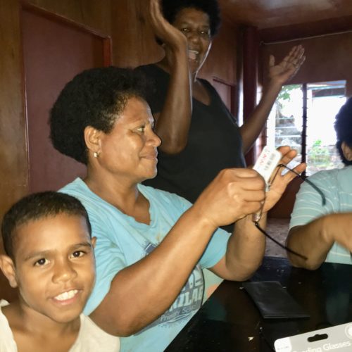 Donating reading glasses in Lavena Island Spirit Fiji